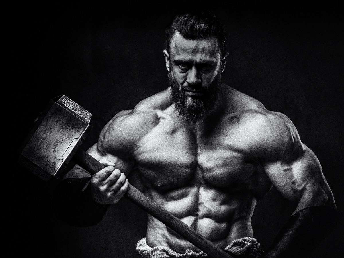 Bodybuilder holding Thor's hammer